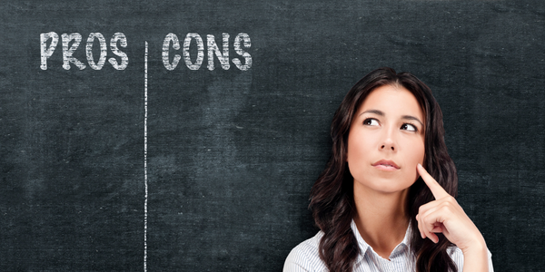 Woman in front of chalkboard with Pros and Cons