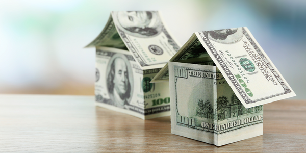$100 bills folded into shape of houses