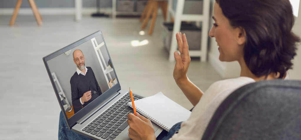 Woman with laptop on a video call with a man